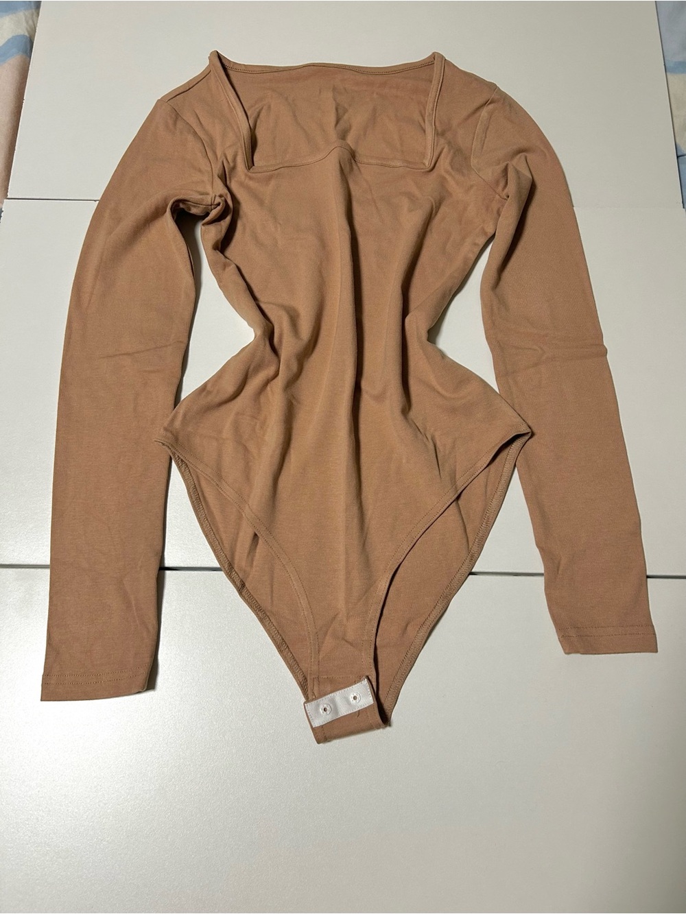 NEVER WORN Long Sleeve One-Piece Bodysuit in Camel